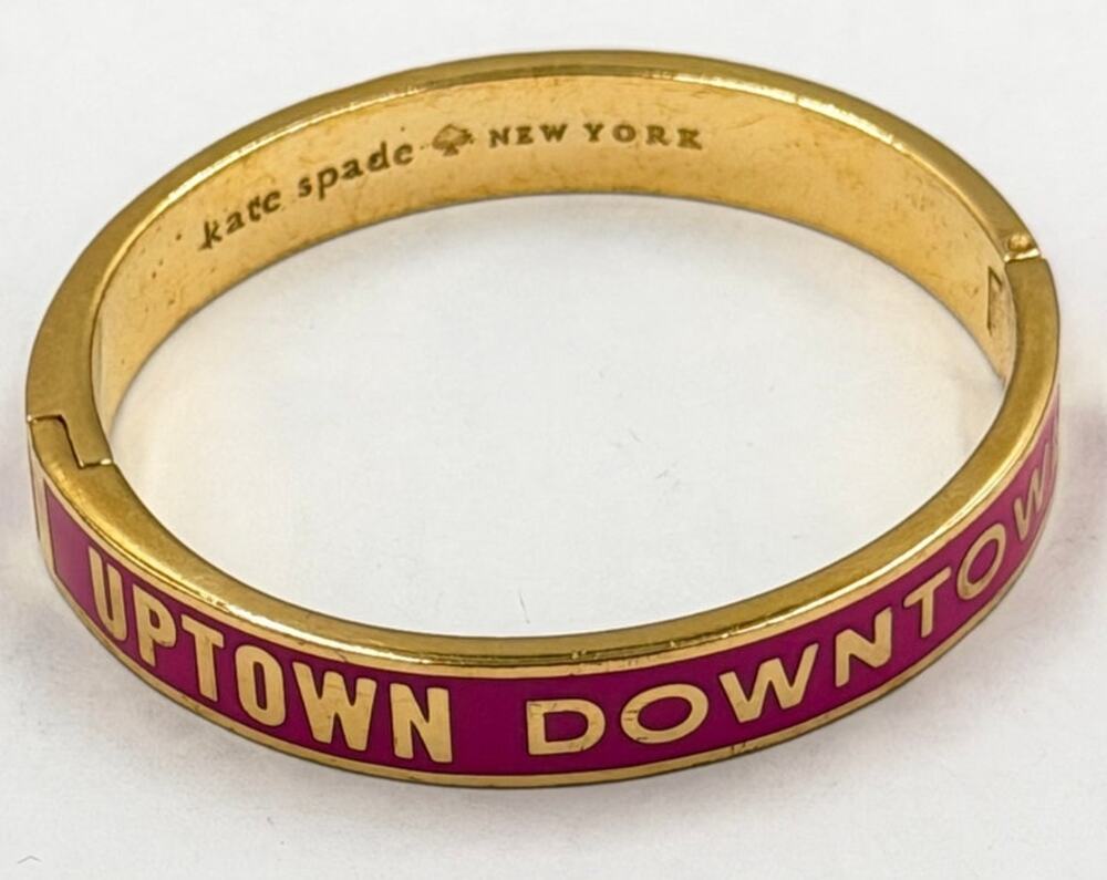 Kate Spade New York "Go the Extra Mile" Idiom Hinged Bangle Bracelet.